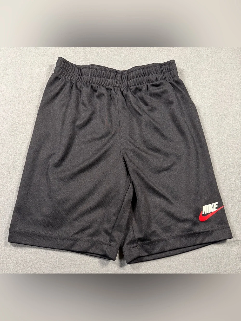 Nike Black Youth Athletic Shorts with Red Logo